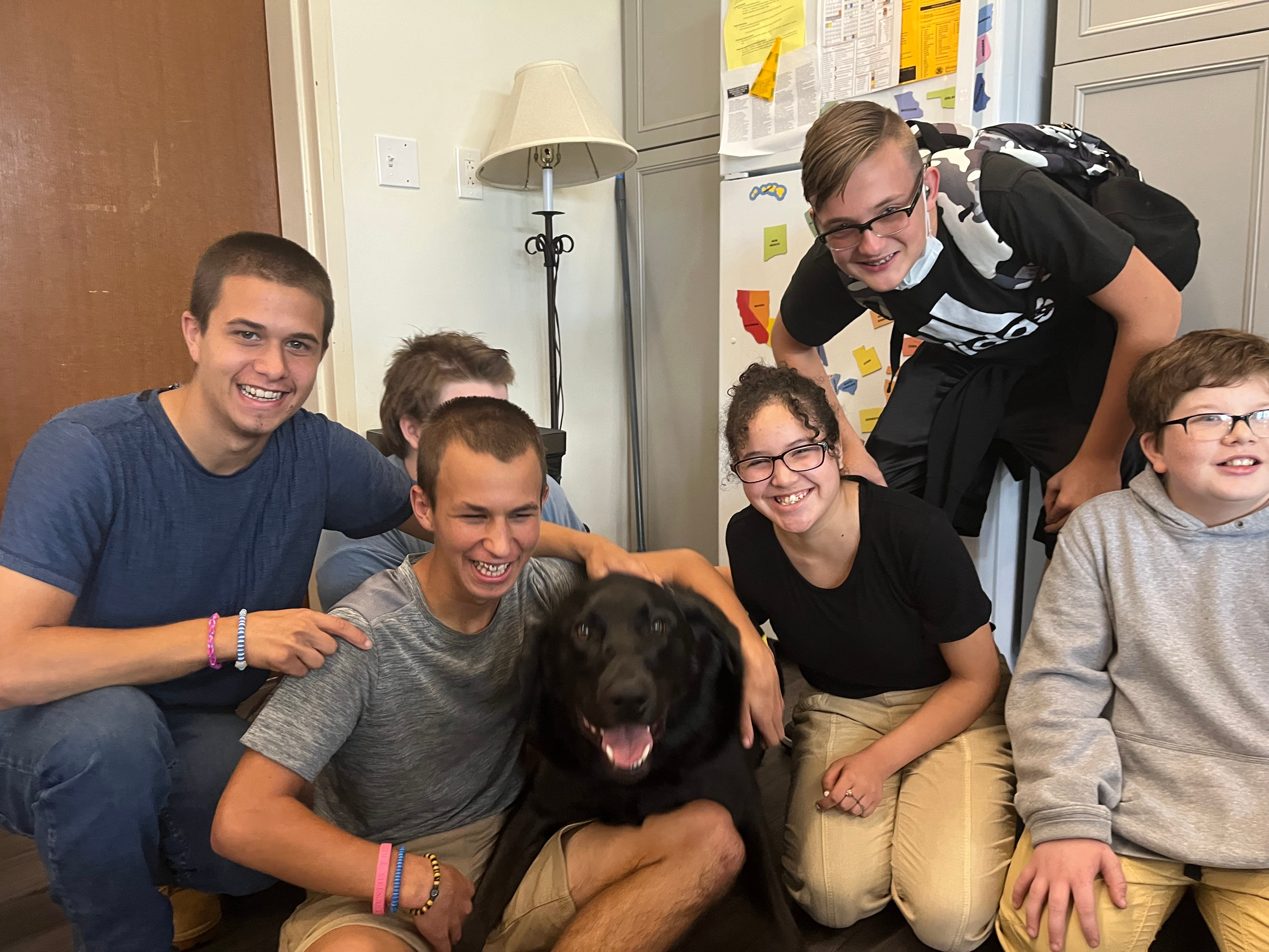 Students with Charlie, one of 10 therapy dogs